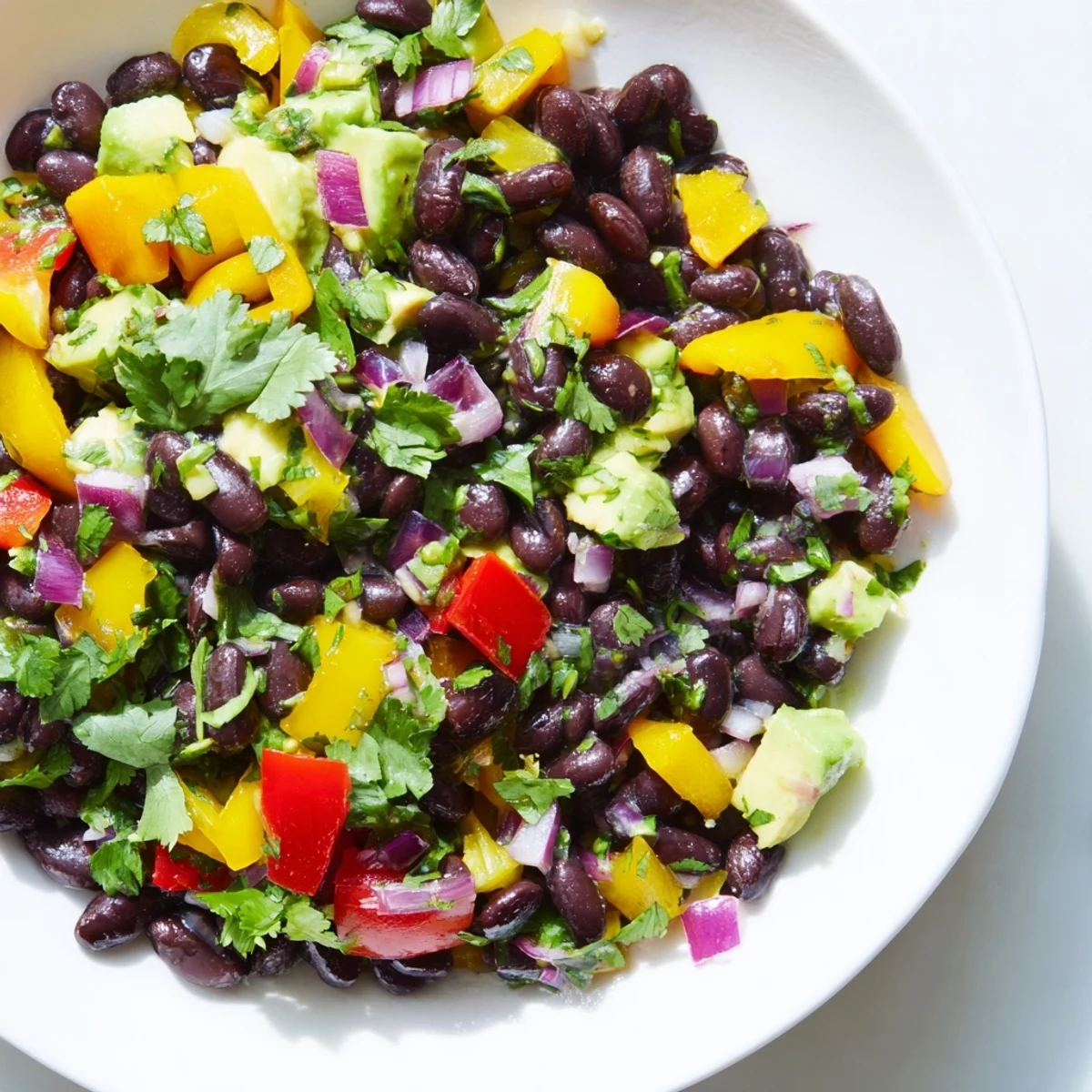 Close-up of Southwest Black Bean Salad, a refreshing vegetarian meal with sweet corn and crunchy vegetables.