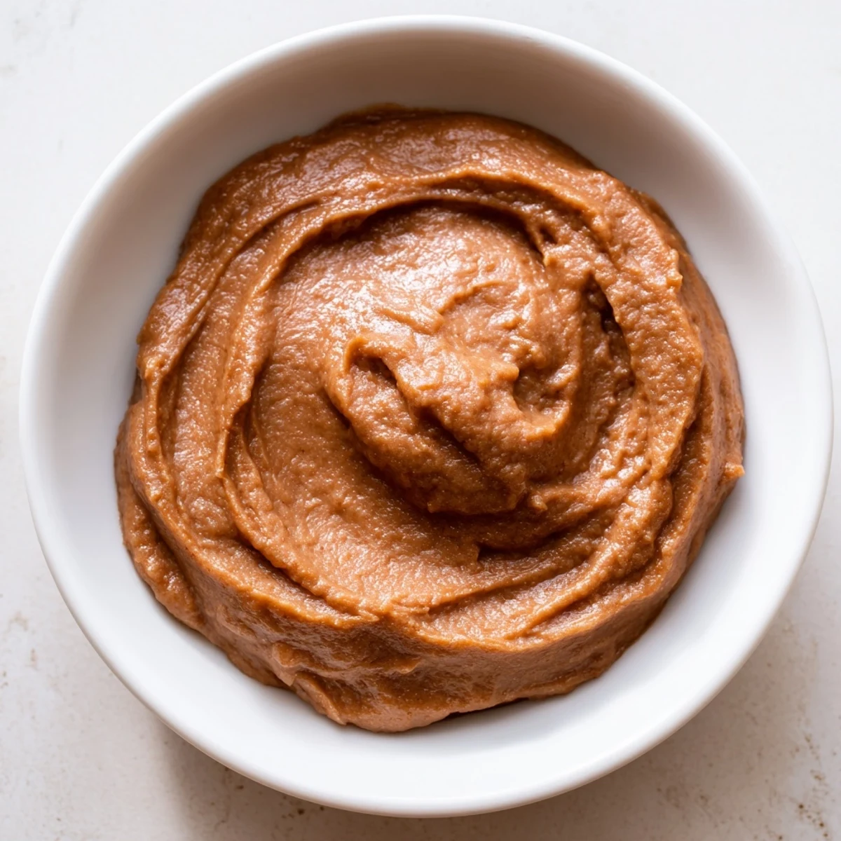 Enjoy the richness of Emirati Al Madrooba: A close-up shows the creamy texture ready to serve.