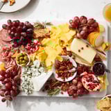 Festive Jingle Bell Cheese Board, showcasing creamy brie, sharp cheddar, and delicious charcuterie, perfect for entertaining.