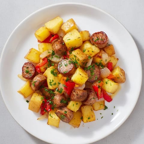 Sizzling Breakfast Bratwurst Hash with crispy potatoes and a vibrant mix of colorful vegetables.