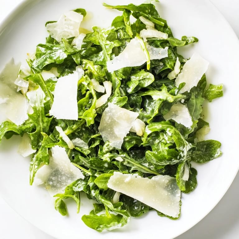 This beautiful Arugula Salad with Lemon Dressing features vibrant greens and a light, flavorful dressing.