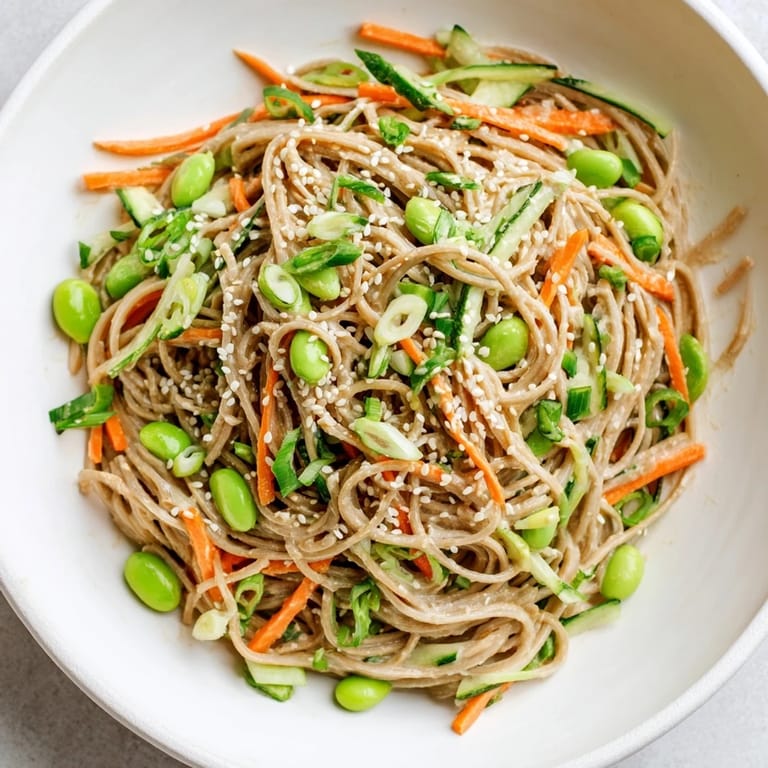 Creamy sesame dressing coats cold Asian Sesame Noodle Salad, a perfect light lunch or flavorful side dish.